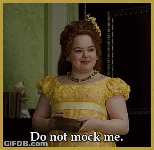 Woman In Yellow Dress Holding Book Says Do Not Mock Me GIF