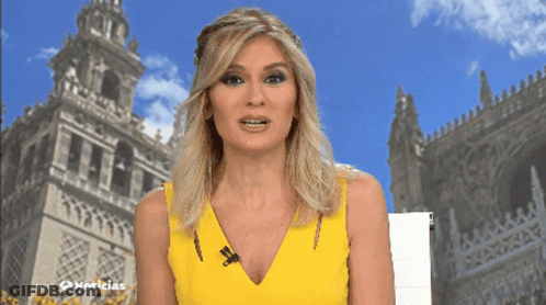 Woman In Yellow Dress In Front Of Noticias Building GIF
