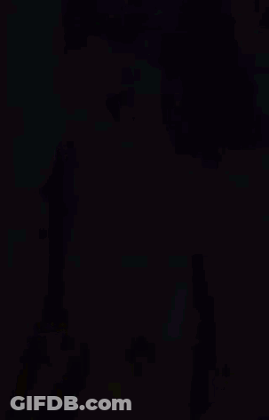 Woman In Yellow Dress In Front Of Purple Background GIF