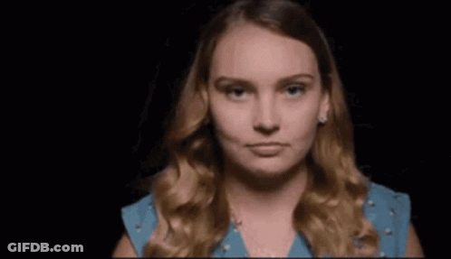 Woman In Yellow Dress Looking In Mirror Saying Me GIF