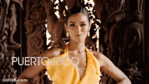 Woman In Yellow Dress Next To Puerto Rico Sign GIF