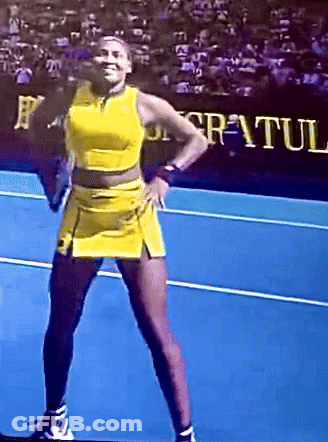 Woman In Yellow Dress On Blue Tennis Court GIF