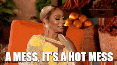 Woman In Yellow Dress On Orange Chair Saying Hot Mess GIF