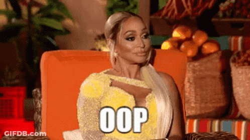 Woman In Yellow Dress Sitting In Orange Chair GIF