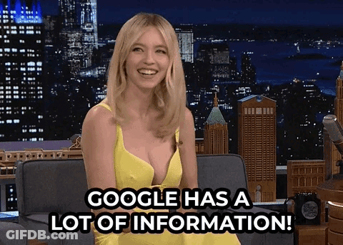 Woman In Yellow Dress Sitting On Couch GIF