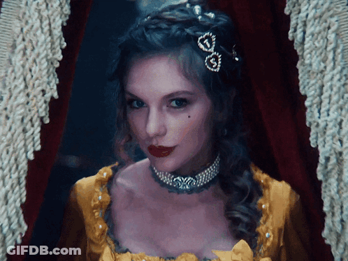Woman In Yellow Dress With Heart Necklace GIF