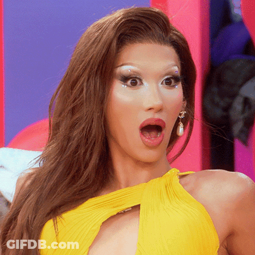 Woman In Yellow Dress With Open Mouth GIF