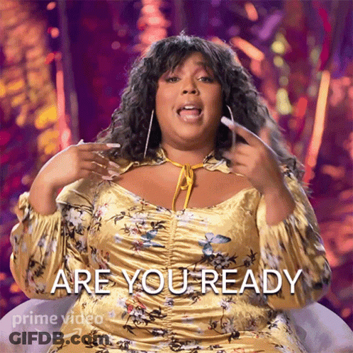 Woman In Yellow Floral Dress Asks Are You Ready GIF