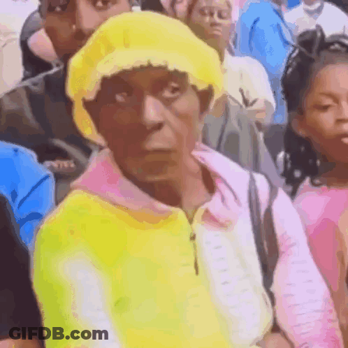Woman In Yellow Hat And Pink Sweater GIF