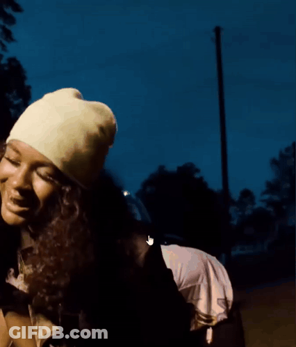 Woman In Yellow Hat Close Up GIF