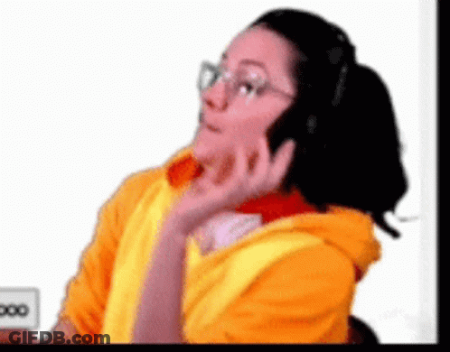 Woman In Yellow Hoodie Talking On Phone GIF