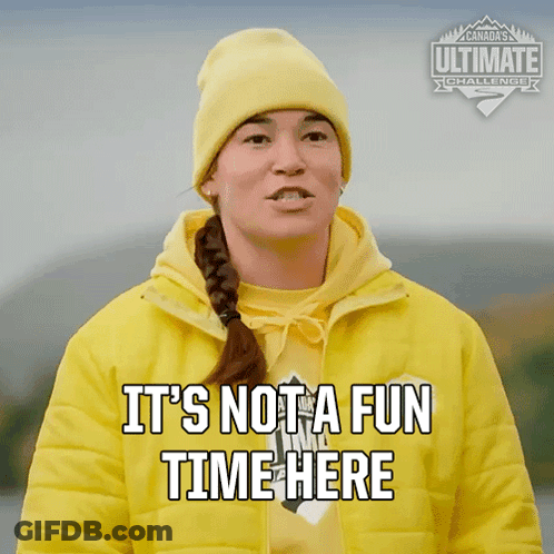 Woman In Yellow Jacket And Beanie Says It's Not A Fun Time Here GIF