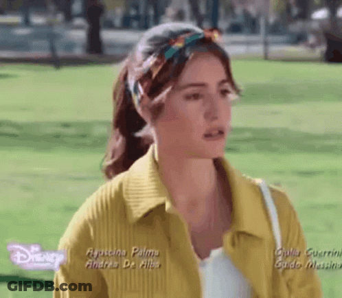 Woman In Yellow Jacket And Headband GIF