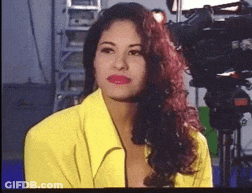 Woman In Yellow Jacket And Red Lipstick GIF