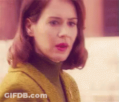 Woman In Yellow Jacket And Turtleneck GIF