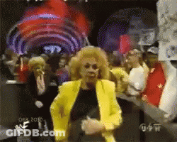 Woman In Yellow Jacket Dancing At Wrestlemania GIF