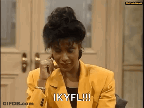 Woman In Yellow Jacket On Phone Saying Ikyfl GIF