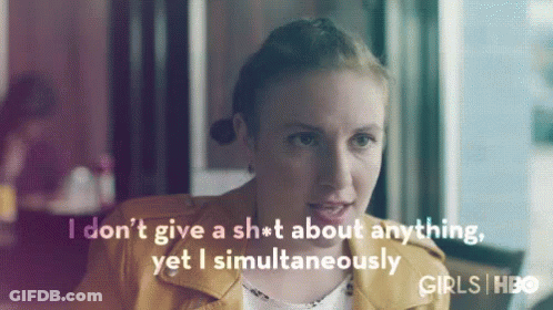 Woman In Yellow Jacket Saying I Don't Give A Sh*t GIF