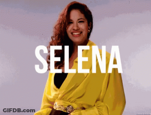 Woman In Yellow Jacket Smiling With Selena GIF