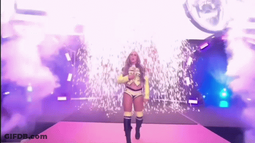 Woman In Yellow Jacket Walking Down Stage GIF