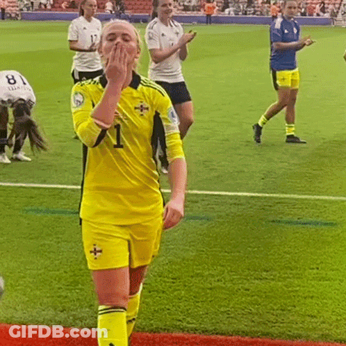 Woman In Yellow Jersey Number 1 On Soccer Field GIF