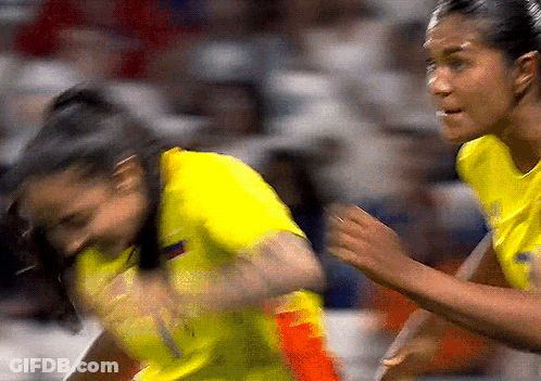 Woman In Yellow Jersey Number 1 Running GIF