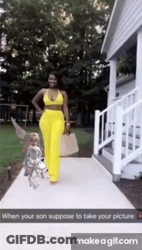 Woman In Yellow Pants Walking Sidewalk GIF