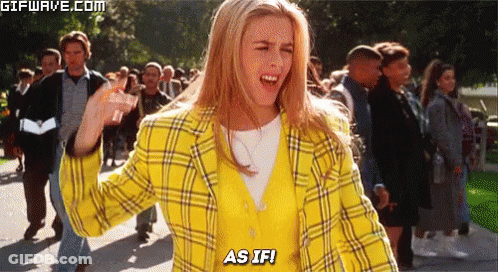 Woman In Yellow Plaid Jacket Facing Crowd GIF