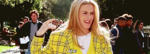 Woman In Yellow Plaid Jacket Talking To Crowd GIF