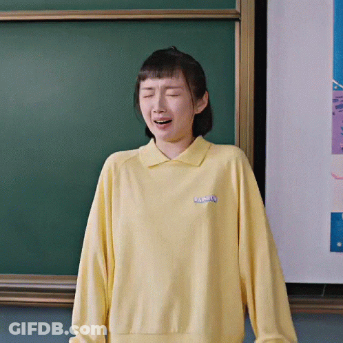 Woman In Yellow Rainbow Sweatshirt GIF