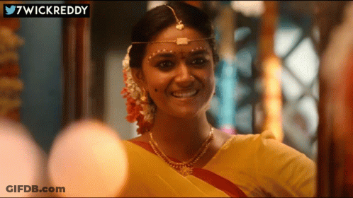 Woman In Yellow Sari Smiling With 7Wickreddy GIF