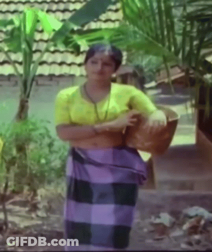 Woman In Yellow Shirt And Purple Skirt GIF