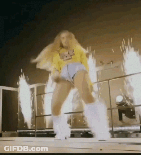 Woman In Yellow Shirt And Shorts Dancing GIF