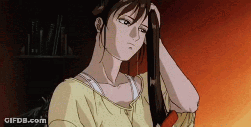 Woman In Yellow Shirt Brushing Hair GIF