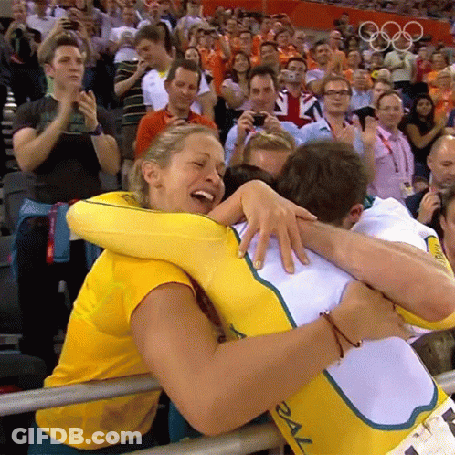 Woman In Yellow Shirt Hugging Man In White With 2X GIF