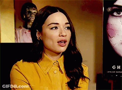 Woman In Yellow Shirt In Front Of Ch Poster GIF
