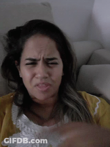 Woman In Yellow Shirt Making Funny Face GIF