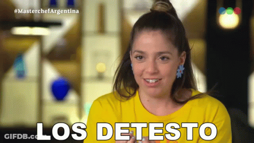 Woman In Yellow Shirt Smiling Saying Los Detesto GIF