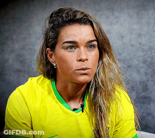 Woman In Yellow Shirt With Green Trim GIF