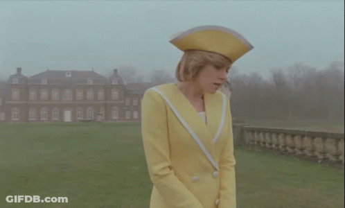 Woman In Yellow Suit And Hat GIF