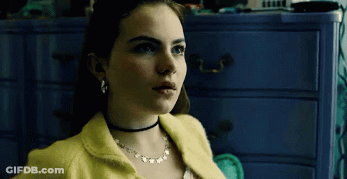 Woman In Yellow Sweater And Choker GIF