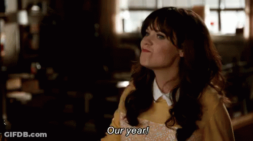 Woman In Yellow Sweater Saying Our Year Looking Up GIF