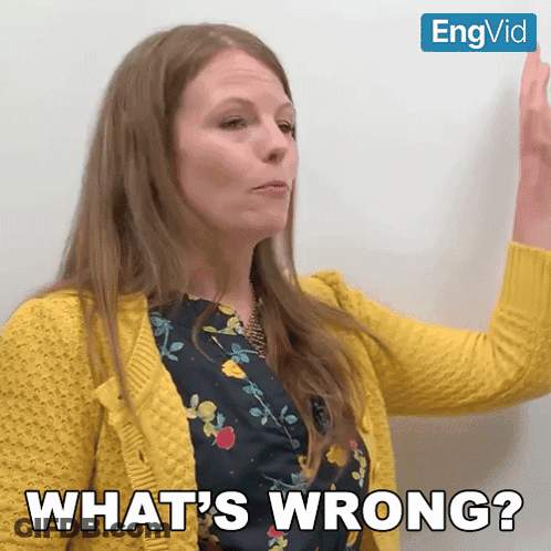 Woman In Yellow Sweater Says Whats Wrong GIF