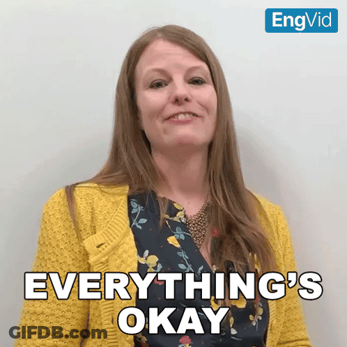 Woman In Yellow Sweater Smiling Says Everything's Okay GIF