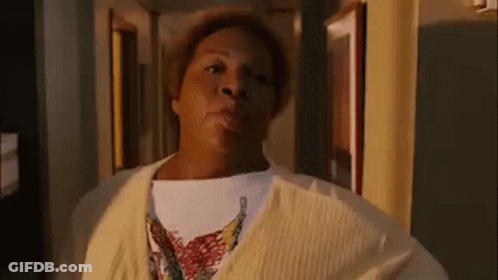 Woman In Yellow Sweater Standing GIF