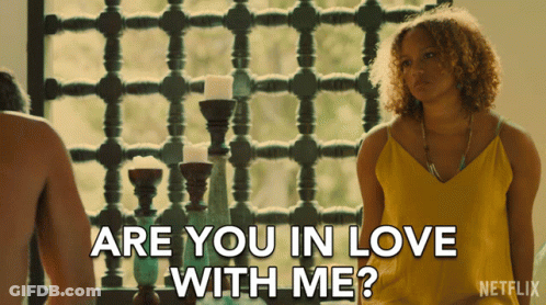 Woman In Yellow Tank Top Asking About Love GIF