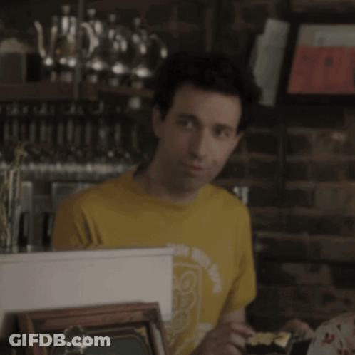 Woman In Yellow Tank Top Sitting With Man GIF
