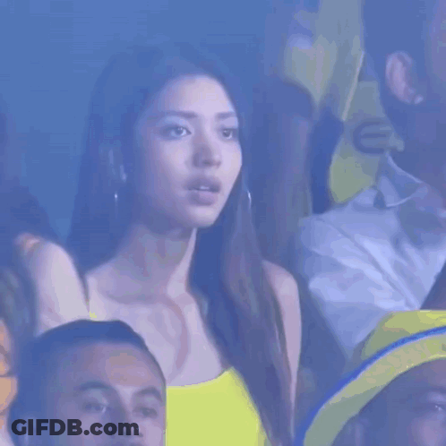 Woman In Yellow Tank Top Watching Game GIF