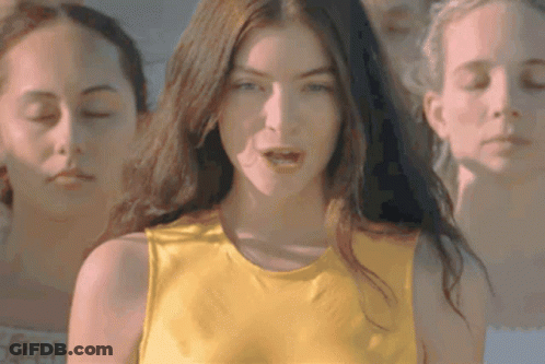 Woman In Yellow Tank Top With Two Others GIF