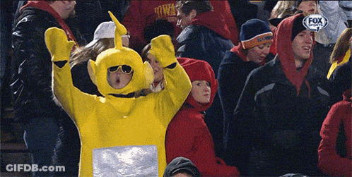 Woman In Yellow Teletubbies Costume In Crowd Watching Fox Sports Game GIF
